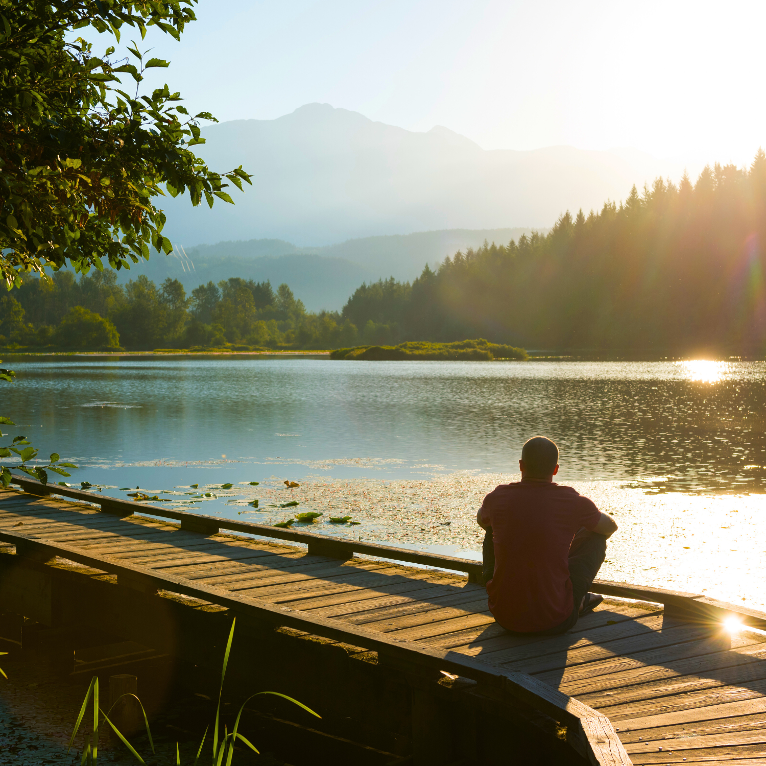 man meditating by the river